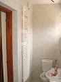 badkamer met vloerverwarming en designradiator
